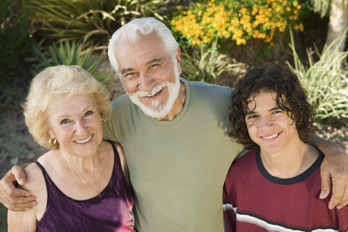 Hispanic family supporting an elderly loved one through a life transition