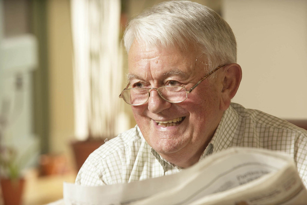 Happy older man enjoying daily life and independence at home
